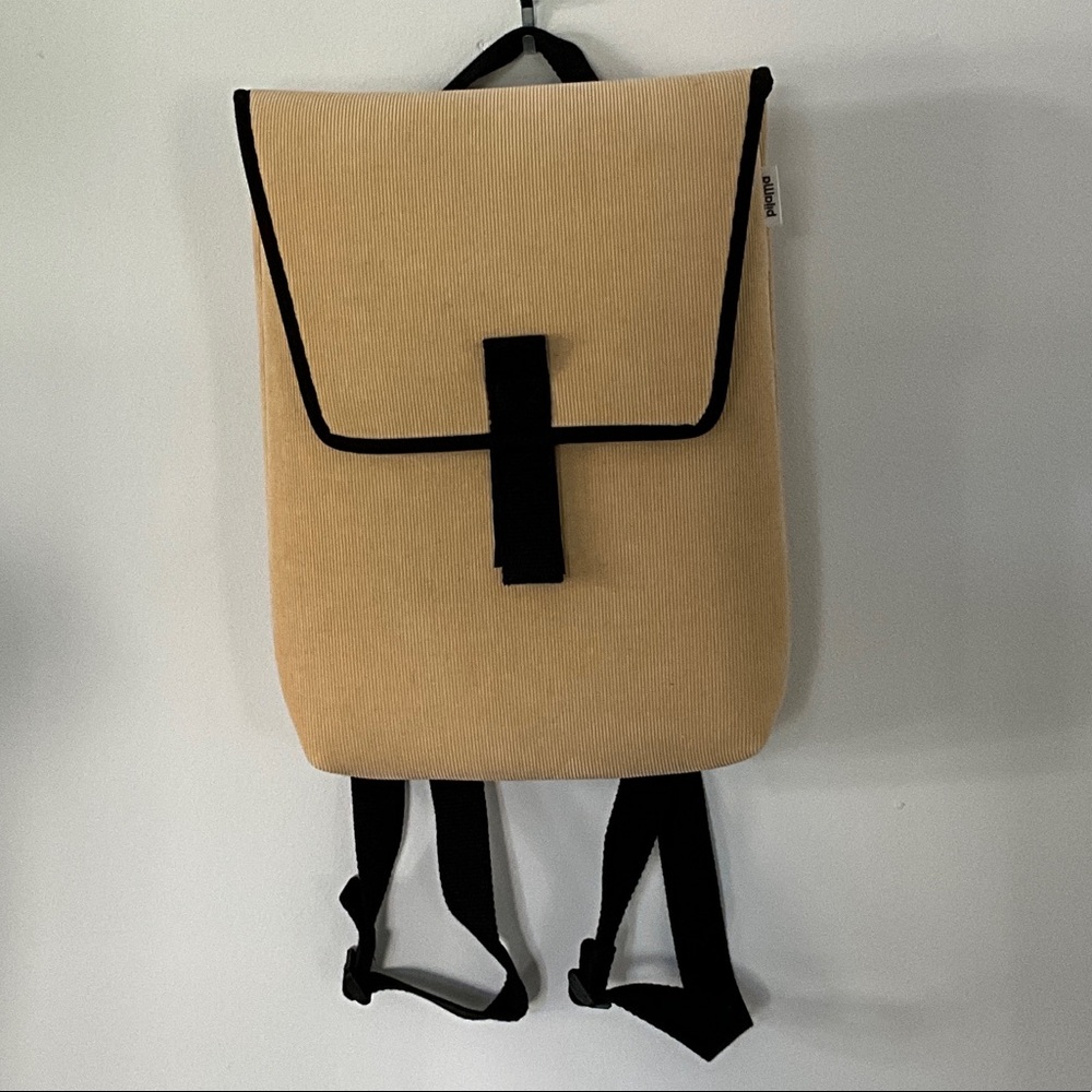 Stylish Tan Backpack with Black Accents